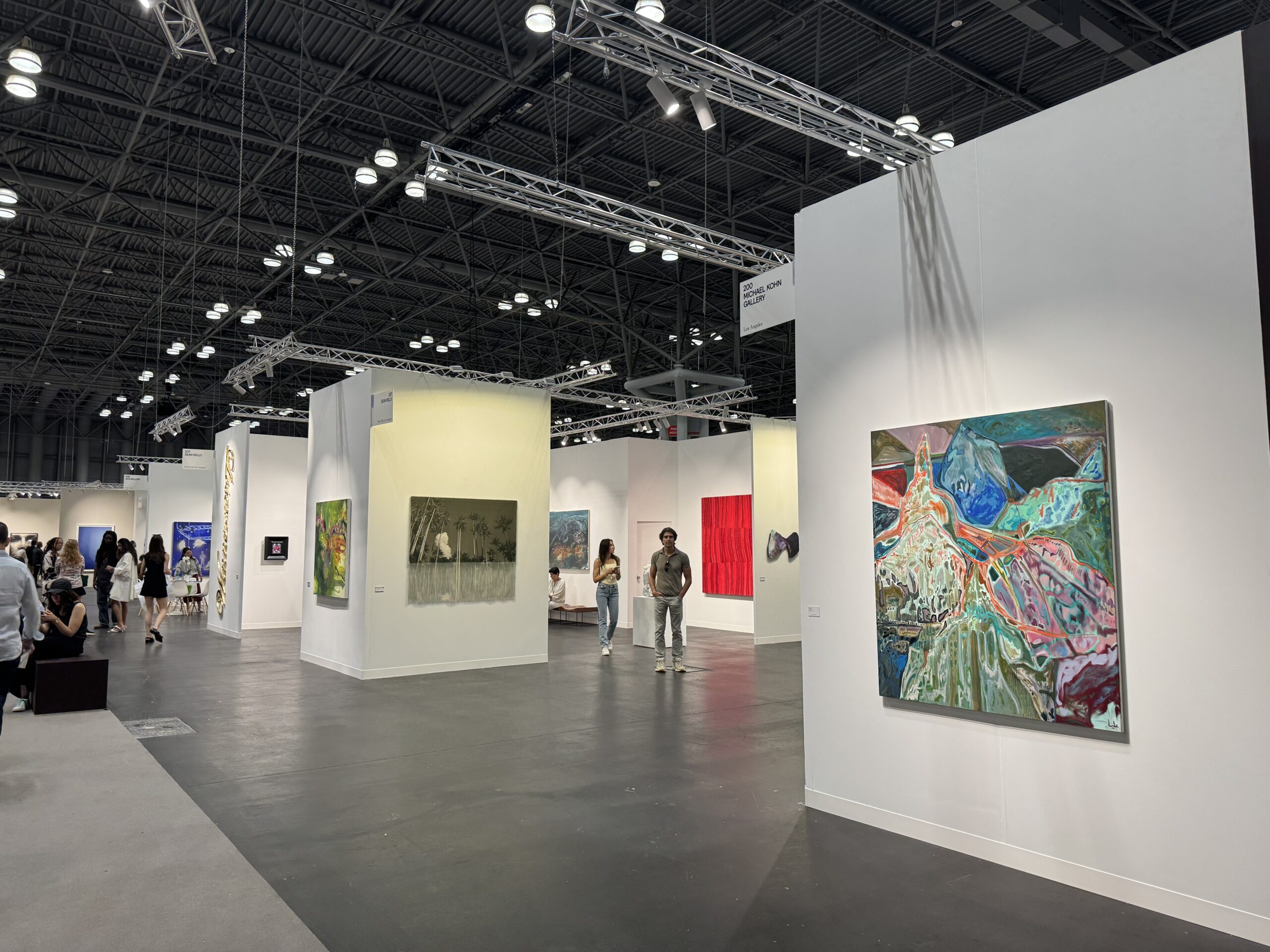 couple looking at paintings in a gallery